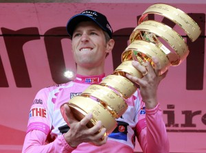 Pink jersey holder and overall leader Garmin-Barracuda's Hesjedal of Canada holds the trophy after the 30km (18 miles) time trial in the 21st and last stage of the Giro d'Italia cycling race in Milan