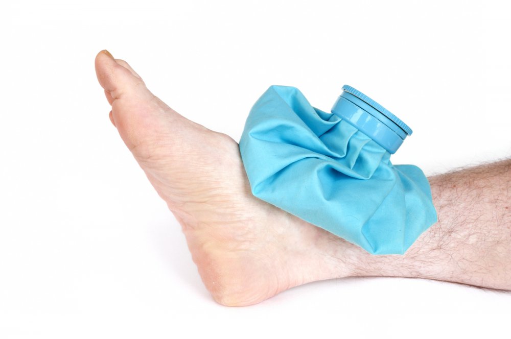 bigstock-icing-a-sprained-ankle-with-ic-9024436