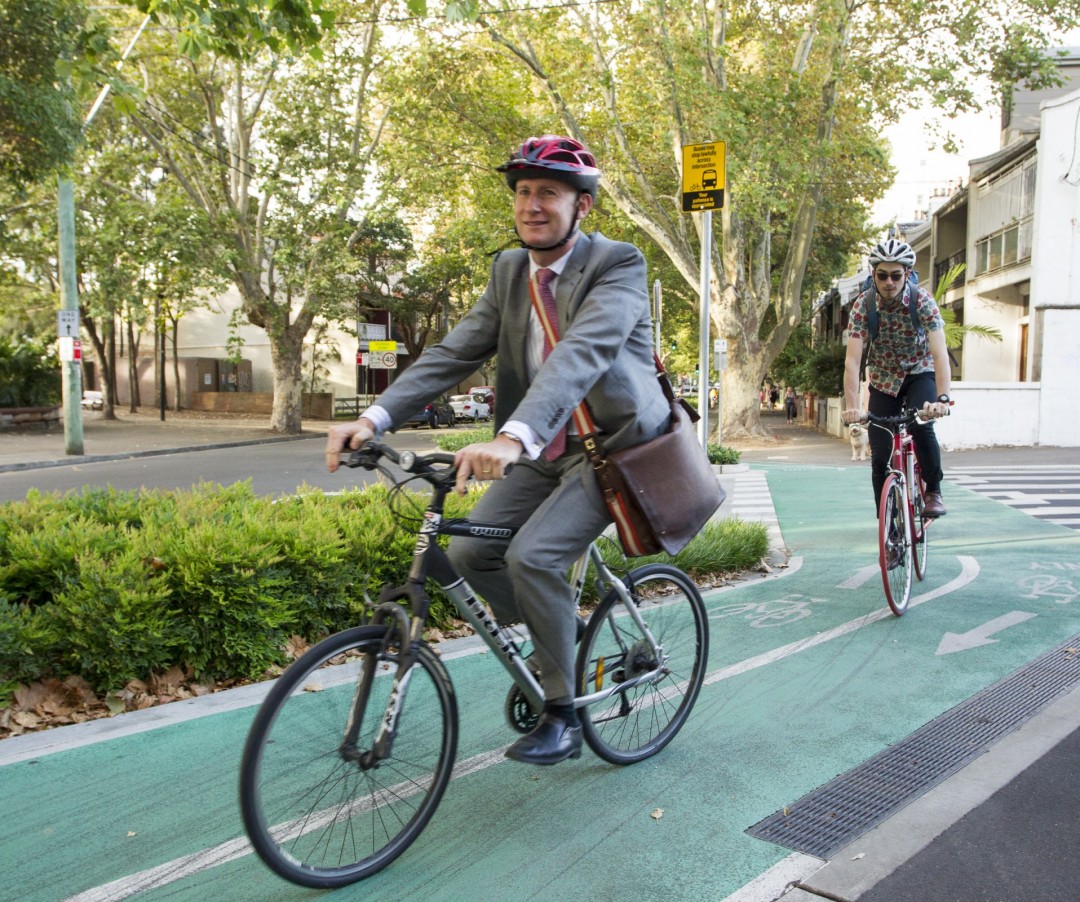 man with suit commute bike lane